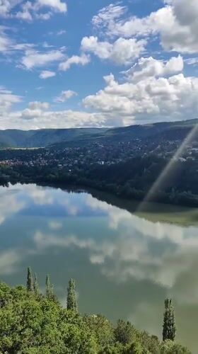 Pancharevo Lake from above, green hills and calm water