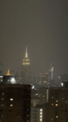 Empire State Building shrouded in fog during early morning hours