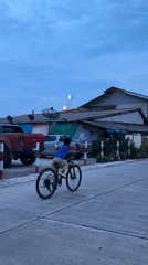 Wheelie attempt on a quiet Ko Pha-ngan street