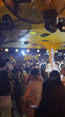 Crowded bar party captured in Chiang Mai, Thailand