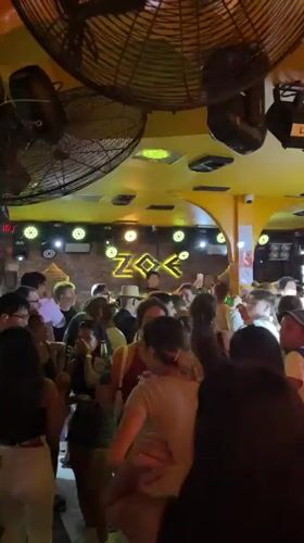 Crowded bar party captured in Chiang Mai, Thailand