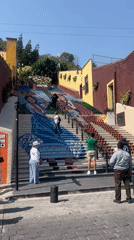 Traditional dress mural adorns public stairway in Atlixco