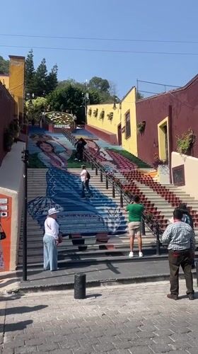 Traditional dress mural adorns public stairway in Atlixco