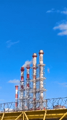 Person documents power plant visit with selfie, multiple views
