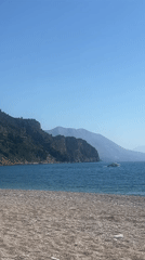 Beach relaxation and boat activity in Prijevor Montenegro
