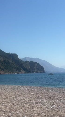 Beach relaxation and boat activity in Prijevor Montenegro