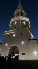 White building illuminated with star projections in Dachnoe, Russia