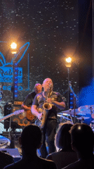 Saxophone and guitar duo performing live on stage in Podgorica