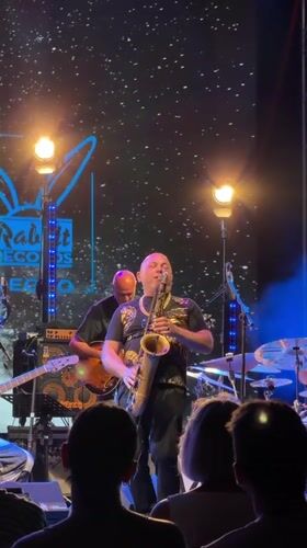 Saxophone and guitar duo performing live on stage in Podgorica