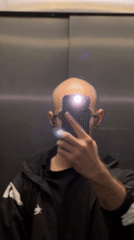 Man Takes Selfie in Elevator