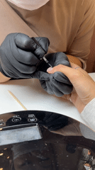 Nail technician provides manicure, pedicure services in Moscow salon