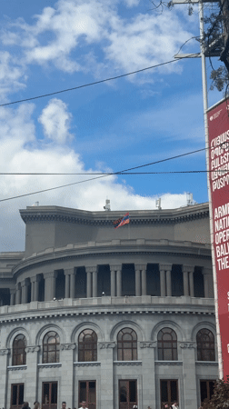 Street musician performs around Yerevan landmarks on Sunday morning
