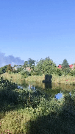Quiet riverbank scene in Kryvyi Rih on a summer afternoon