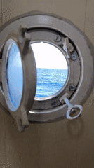 Ship porthole view captures ocean scene near Indonesia