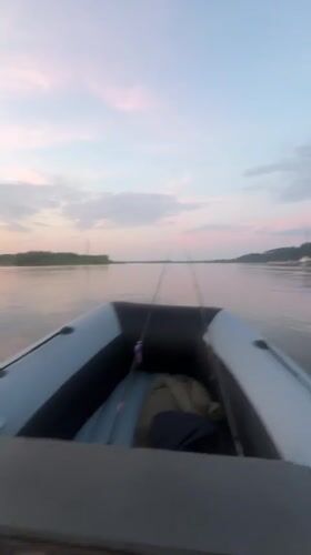 Fishing at dusk on a calm Ural river