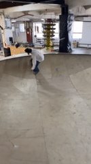 Skateboarders practice tricks at indoor Yekaterinburg skate park