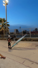 Skateboard sailing and BMX tricks at a Barcelona skatepark at dusk