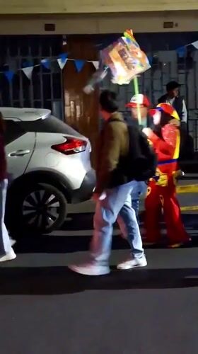 Clown performers spotted on Peru city streets during evening hours