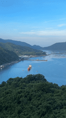 Cargo ship spotted in tranquil Hòa Xuân bay scene
