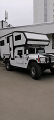 Modified Hummer camper with dual flags spotted in Moscow