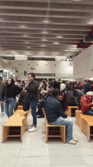 Crowds gather inside a Santiago cultural venue late evening