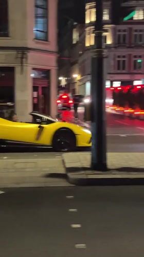 Late-night London streets: luxury cars, rollerbladers, lit-up squares