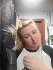 Woman documents hair-drying routine in Chaikovsky bathroom selfies