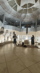 Musical performance among ancient stone artifacts in Abakan museum