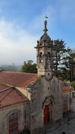 Historic stone church with bell tower documented in Santiago