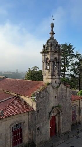 Historic stone church with bell tower documented in Santiago
