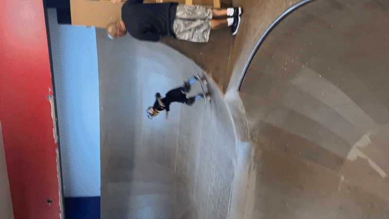 Indoor skatepark session on a curved ramp in Bluewater