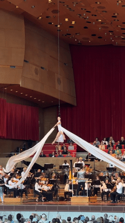 Aerial performers and orchestra share the Pritzker Pavilion stage
