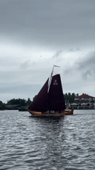 Giethoorn canal village by boat on a cloudy morning