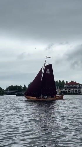 Giethoorn canal village by boat on a cloudy morning