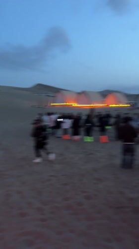 Desert camping group enjoys circle dancing, bonfires near Dunhuang