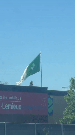 Franco-Ontarian flag flies on sunny day in Ottawa