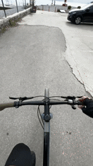 Cyclist documents waterfront journey to lighthouse in Tivat, Montenegro
