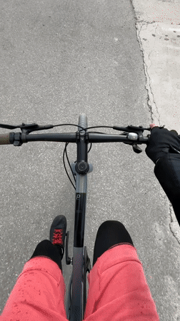 Cyclist documents waterfront journey to lighthouse in Tivat, Montenegro