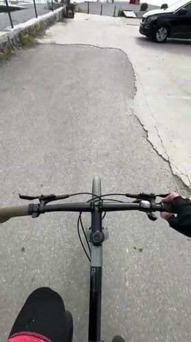 Cyclist documents waterfront journey to lighthouse in Tivat, Montenegro