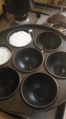 Morning cooking session features traditional round griddle cakes in Nigeria