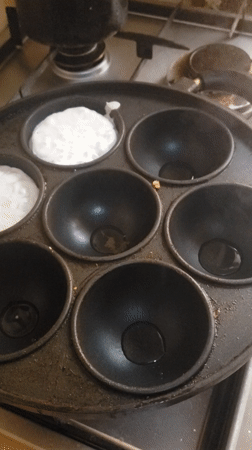 Morning cooking session features traditional round griddle cakes in Nigeria