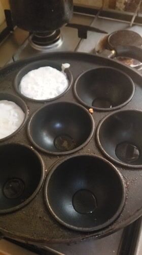 Morning cooking session features traditional round griddle cakes in Nigeria