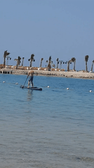 Man enjoys paddleboarding and kayaking in Hurghada waters