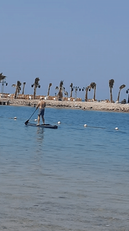 Man enjoys paddleboarding and kayaking in Hurghada waters