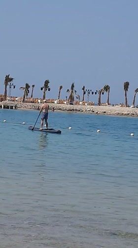 Man enjoys paddleboarding and kayaking in Hurghada waters