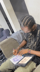 Portrait sketching during a relaxed Abuja apartment hangout
