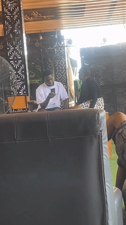 Afternoon hangout at an outdoor bar in Howayi, Nigeria