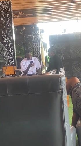 Afternoon hangout at an outdoor bar in Howayi, Nigeria