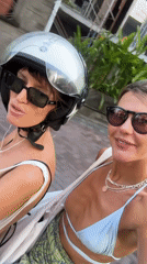Two women share late-night moped ride in North Kuta