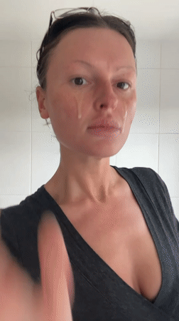 Woman applies makeup in Tunbridge Wells bathroom